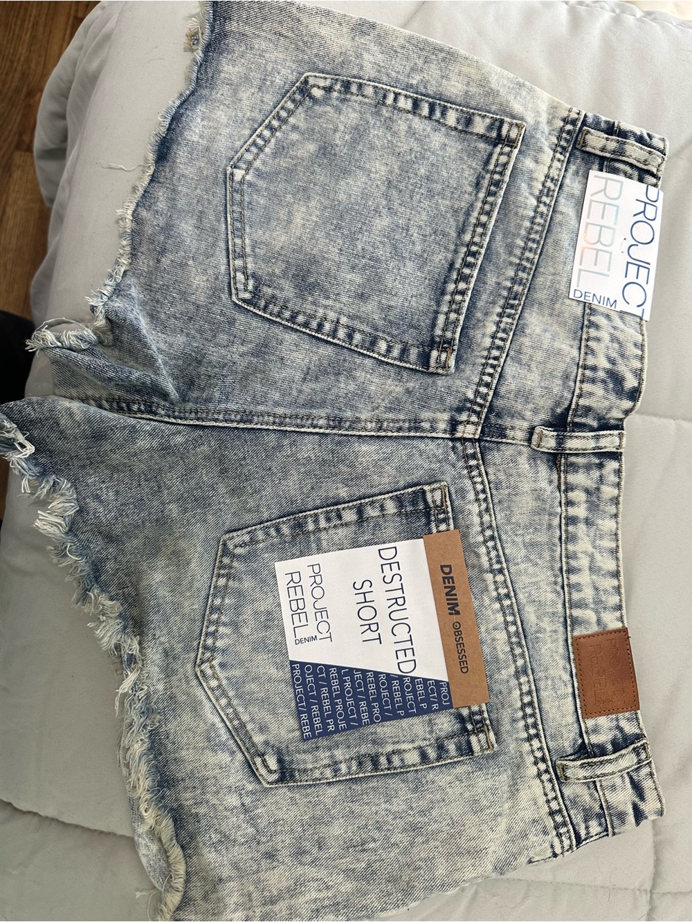 rebels Light Acid-Wash Distressed Denim Shorts